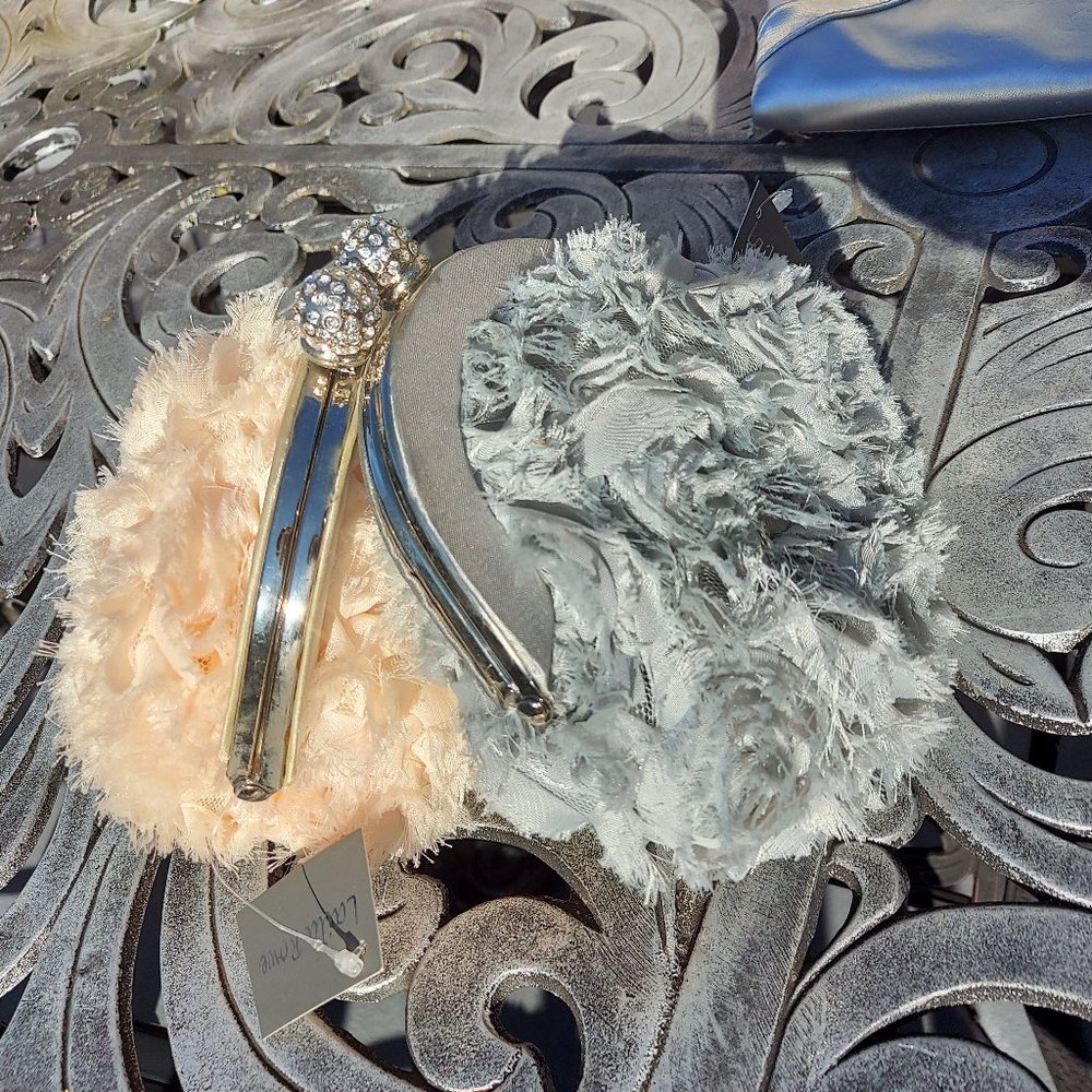 Cream and silver evening clutches